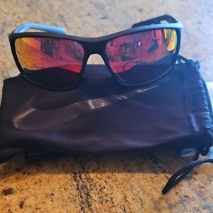 Nike Black Sunglasses with Reflective Red Lenses.  Unisex